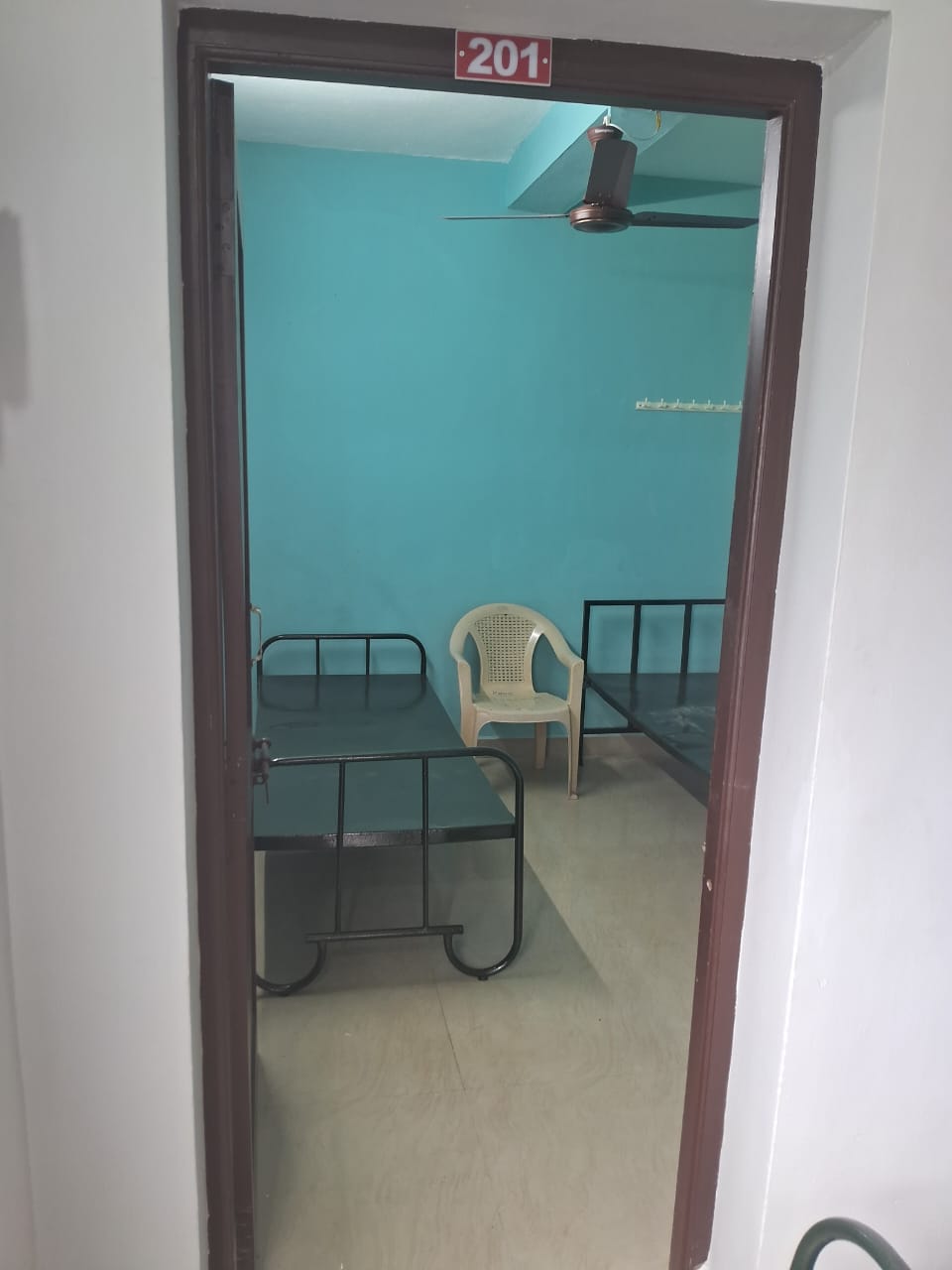 Shared TV hall and entertainment area at Tamilan PG for Men